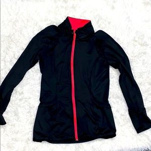 Athletic jacket in black and coral lining